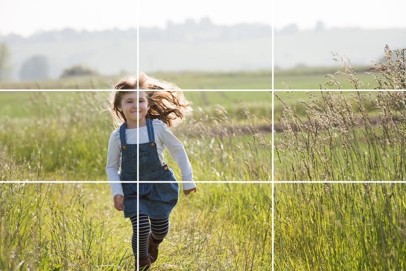use the gridlines in your photos - picture of girl running in a meadow